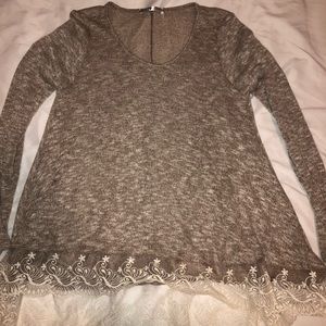 Tanish brown sweater with lace on the bottom